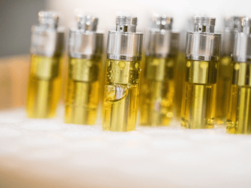 image of thca live resin carts being filled for manufacturing and packaging