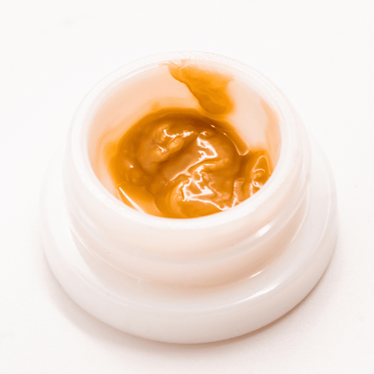 Skoranges THCA solventless live rosin dabs with rich texture and potent aromatic compounds.