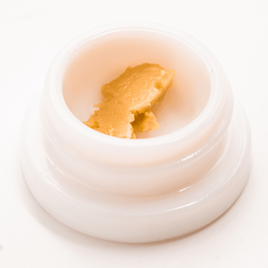 Skywalker OG THCA solventless live rosin dabs with golden hues, rich in cannabinoids and terpenes.