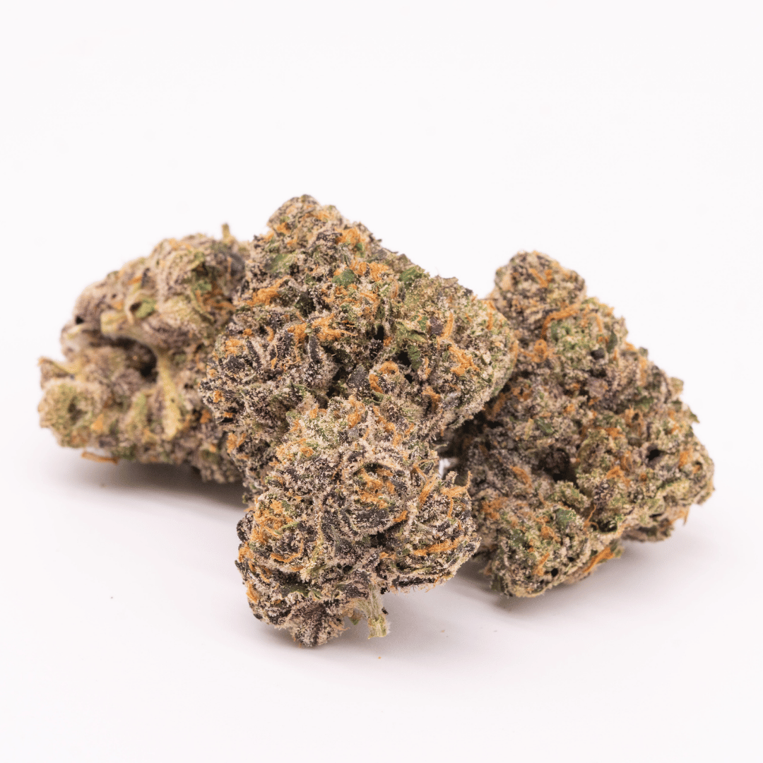 Cluster of White Runtz buds showing off the hybrid’s signature purple and green colors with heavy trichome coating.