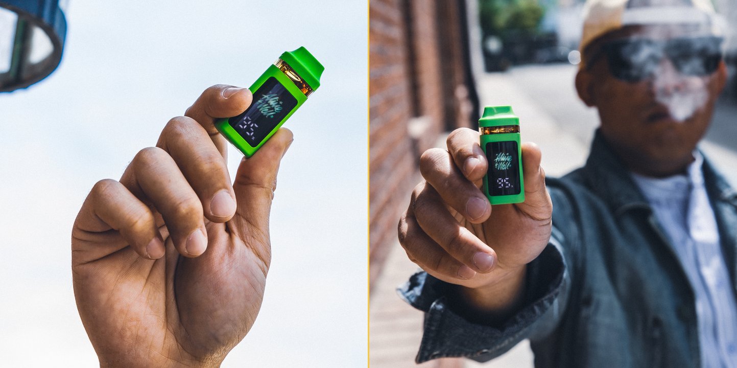 Two views of the new Alive & Well Digital Disposable — held against the sky and held in hand on a street.